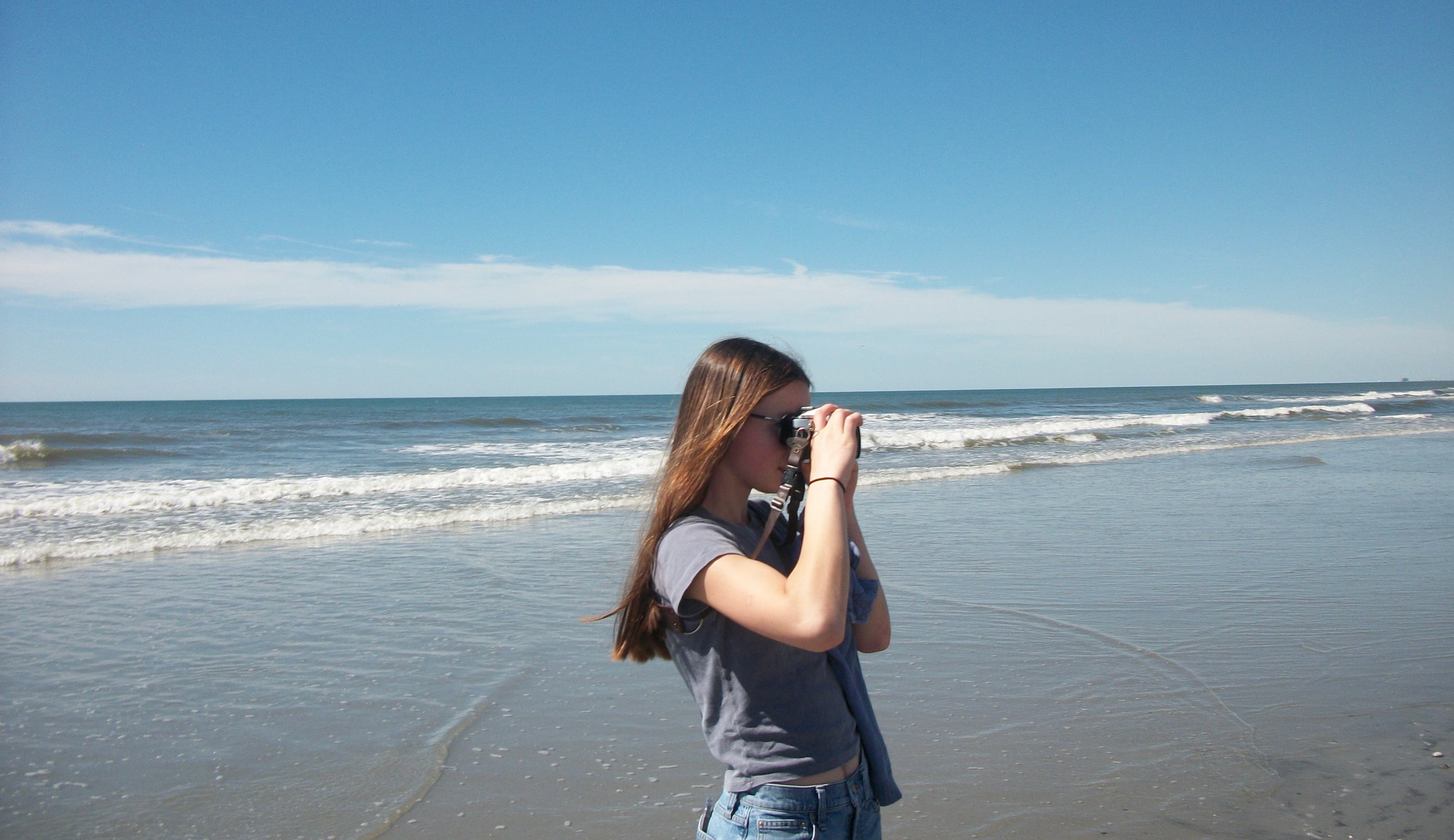 Maya creating media content on the beach